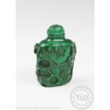 A Chinese carved malachite snuff bottle and stopper, carved to the exterior with prunus blooms, 6.