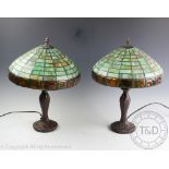 A pair of modern Tiffany style bronzed table lamps, with stained glass shades,