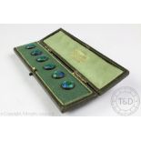 A set of six enamel buttons, each planished and enamelled in blue and green tones, each 1.