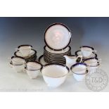 An Edwardian Royal Worcester Regency part tea service comprising; ten teacups and twelve saucers,