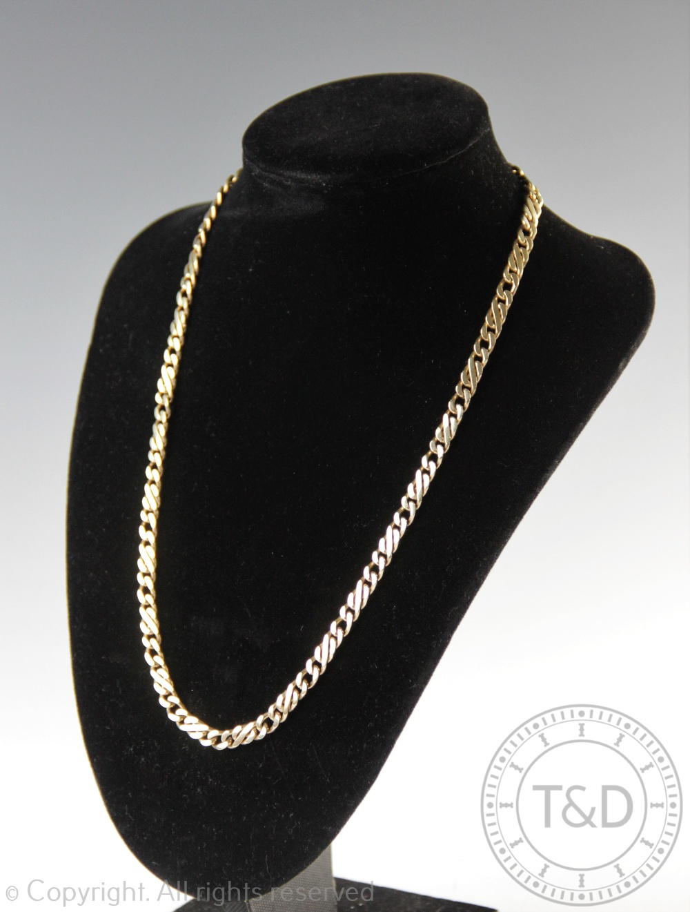 A 9ct yellow gold Figaro type fancy link chain, import mark for London 1990,