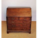 A George III mahogany bureau, with fall enclosing a fitted interior,