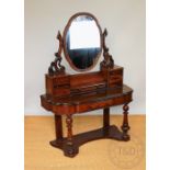 A Victorian carved walnut duchess dressing table,