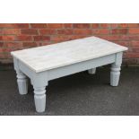 A painted pine coffee table, on turned legs,