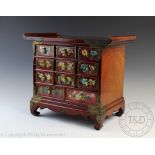 A modern Chinese burr wood table top chest or kodansu, of eleven drawers, 34cm H,