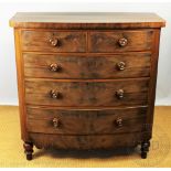 An early 19th century mahogany bow front chest, with two short and three graduated long drawers,
