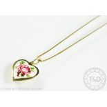 A David Andersen enamelled rose pendant and chain, the heart shaped pendant depicting a pink bloom,