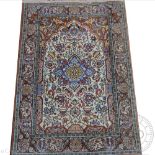 A Persian Kashan wool rug / prayer mat, worked with flowers and urns within a border of animals,