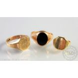 A 9ct yellow gold signet ring, engraved, 5.2gms, an 18ct yellow gold signet ring, 4.