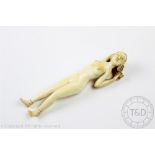 A Chinese ivory medicine doll, late 19th century, modelled as a nude female, 15.