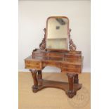 A Victorian walnut duchess dressing table, with three small drawers above five drawers,