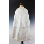 A late Victorian lady's ivory coloured cape, with embroidered floral detailing,