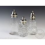 Three silver topped glass sugar sifters to include a George V example, Charles S Green & Co Ltd ,