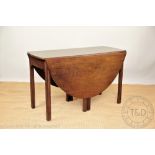 A George III mahogany oval extending dining table, with two hinged leaves, on moulded legs,