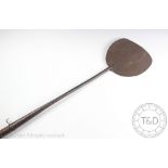 A large 19th century wrought iron and oak handled bread oven paddle,