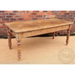 A Victorian pine country farmhouse kitchen table, with a drawer to each end, on turned legs,