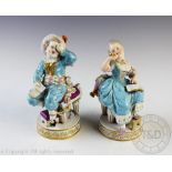 A pair of German porcelain figural groups of children, late 19th century,