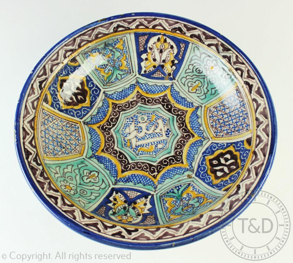 An Islamic tin glazed pottery bowl,