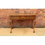 An 18th century style walnut bow front side table / hall table, late 20th century,