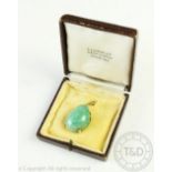 A jade coloured pendant,