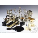 A collection of silver plated wares to include a bottle sleeve, 18cm high, another similar,