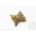 A sapphire set yellow metal clasp,