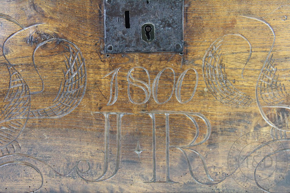 A 19th century oak chest, the hinged top above carved bird detail and '1800' 'J*R' 33. - Image 2 of 2