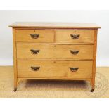 An Edwardian ash chest with two long and two short drawers, each with Secessionist style handles,