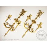 A pair of 19th century carved gilt wood and gesso twin branch wall lights,