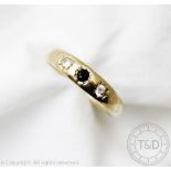 A three stone diamond and sapphire ring,