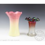 A large vaseline glass vase, with flared crimped rim and graduated pink to yellow body,