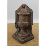 A 19th century carved granite urn / finial, the campana urn partially veiled,