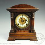 An Edwardian oak 8-day mantel clock,