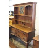 An Arts and Crafts oak dresser by Maple & Co,