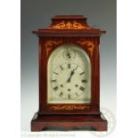 An Edwardian mahognay and marquetry inlaid quarter chiming bracket clock,