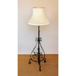 An Arts and Crafts copper and iron adjustable standard lamp,
