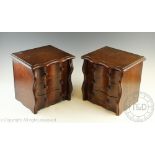 A pair of stained walnut collectors chests, each table top chest with three serpentine drawers,