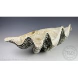 A large clam shell basin,