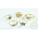 Five assorted rings, comprising; an emerald and diamond three stone ring in 9ct gold,
