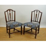 A set of four George III style carved mahogany dining chairs, late 19th century,
