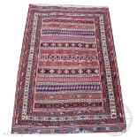A Kilim wool rug, worked with geometric panels in bright colours,