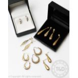 Eleven pairs of assorted pairs of earrings, to include drop, hoops,