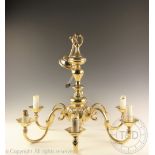 A Dutch style brass chandelier, with six sconce arms,