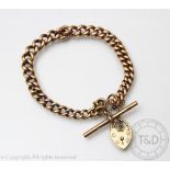 A 9ct gold curb link bracelet with heart shaped padlock clasp, H.
