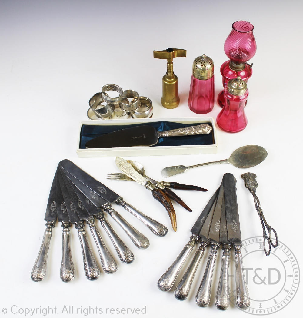 A selection of silver, plated wares and cranberry glass, to include; four silver napkin rings,