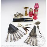 A selection of silver, plated wares and cranberry glass, to include; four silver napkin rings,