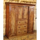 A Victorian mahogany wardrobe, with cornice above, two panelled doors and three long drawers,