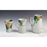 Janice Tchalenko; Two pitchers and a beaker vase, each decorated in the poppy pattern,
