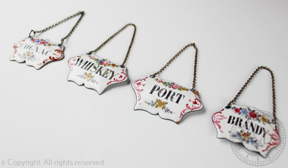 A set of four Victorian enamel decanter labels, titled Whiskey, Cognac,