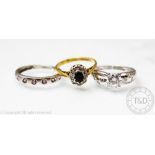 A sapphire and diamond oval cluster ring set in 18ct gold, size K,